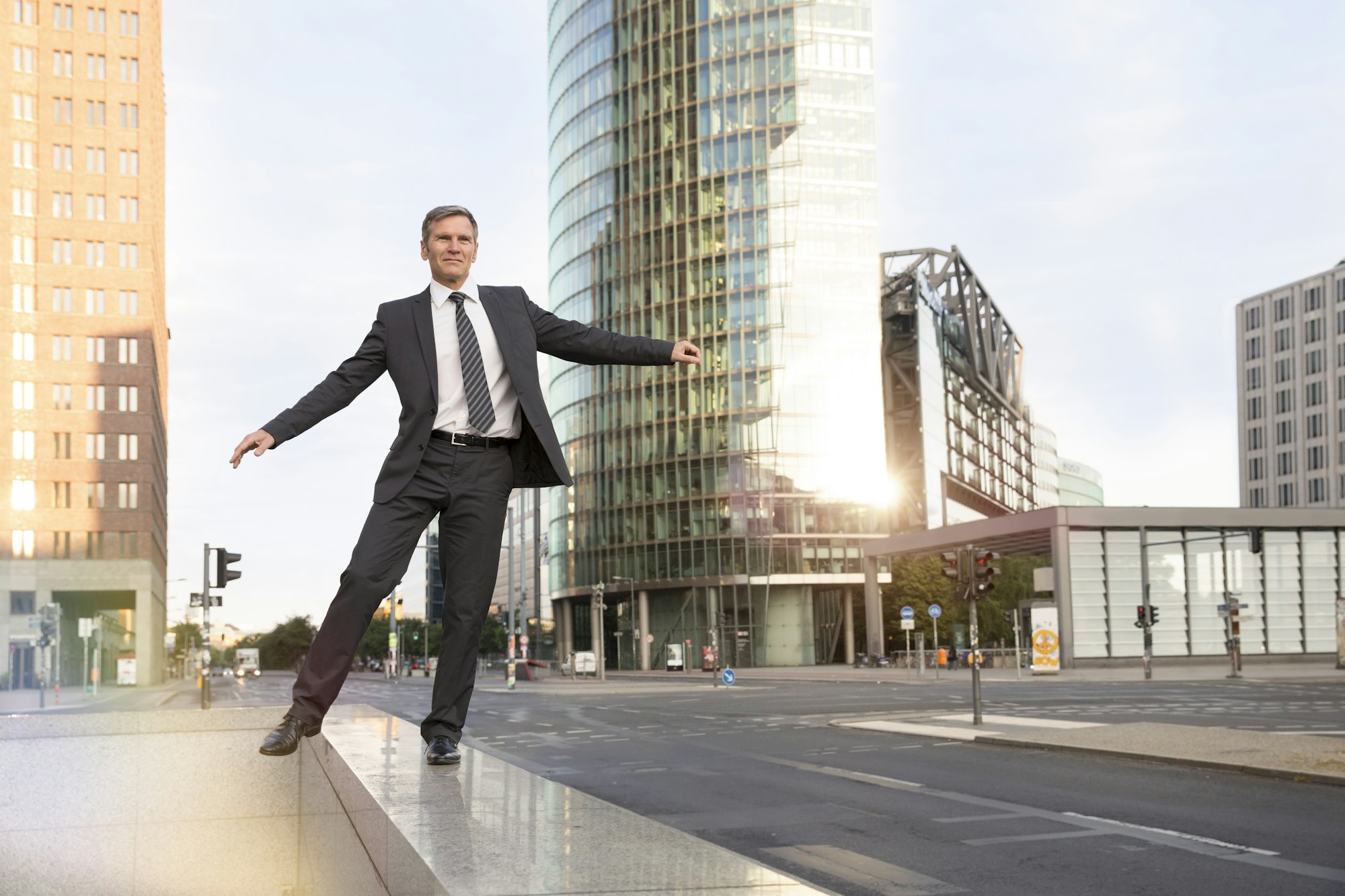 Germany, Berlin, Businessman balancing on balustrade